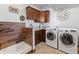 Well-equipped laundry room features modern washer and dryer, with convenient dog wash at 3124 Antelope Ridge Trl, Parker, CO 80138