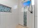 Walk-in shower with tile accents, built-in niche, and sleek fixtures at 3124 Antelope Ridge Trl, Parker, CO 80138
