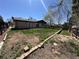 Spacious backyard with brick home, lawn, and garden beds, perfect for outdoor activities and relaxation at 11623 E Virginia Dr, Aurora, CO 80012