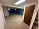 Finished basement featuring carpet, painted blue accent wall, and drop ceiling at 11623 E Virginia Dr, Aurora, CO 80012