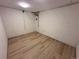 Bright basement room with modern vinyl flooring and white walls, creating a clean and versatile space for various uses at 11623 E Virginia Dr, Aurora, CO 80012