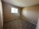 Neutral bedroom featuring carpet floors, a window with blinds, and painted walls at 11623 E Virginia Dr, Aurora, CO 80012