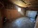 Spacious garage area with concrete flooring and garage door at 11623 E Virginia Dr, Aurora, CO 80012