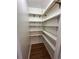 Walk-in pantry featuring plenty of shelves for optimized kitchen storage at 11623 E Virginia Dr, Aurora, CO 80012