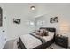 Relaxing bedroom with a padded headboard, soft lighting, and contemporary decor at 1649 Lima St, Aurora, CO 80010