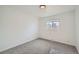 Simple bedroom with neutral carpet and a bright window at 1649 Lima St, Aurora, CO 80010