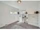 Cozy bedroom with built-in bookshelves and neutral carpet at 1649 Lima St, Aurora, CO 80010