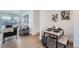 Stylish dining area with seating for four, connecting to a sunlit living space at 1649 Lima St, Aurora, CO 80010