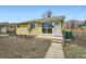 Charming home with a well-manicured lawn and updated landscaping at 1649 Lima St, Aurora, CO 80010