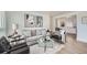 Cozy living room with neutral-toned sofa, modern art, and stylish accent furniture at 1649 Lima St, Aurora, CO 80010
