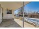 Covered patio with view of fenced backyard and storage shed at 8839 Winona Ct, Westminster, CO 80031