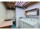 Clean basement laundry room with washer, dryer, and utility sink at 8839 Winona Ct, Westminster, CO 80031