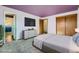 Virtually staged main bedroom with large closet and access to the kitchen at 8839 Winona Ct, Westminster, CO 80031