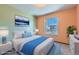 Virtually staged bedroom with blue accents and a neutral color scheme at 8839 Winona Ct, Westminster, CO 80031