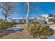 Charming ranch home with mature trees and a partially snow-covered yard at 8839 Winona Ct, Westminster, CO 80031