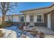 House exterior featuring a covered entryway and brick detailing at 8839 Winona Ct, Westminster, CO 80031