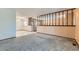 Open living room with a partial wall and neutral carpeting at 8839 Winona Ct, Westminster, CO 80031