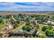 Aerial view outlines the property's mature trees, open fields, and boundary at 1813 Pikes Peak St, Erie, CO 80516