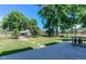 Expansive backyard featuring lush lawn, mature trees, privacy fence and a shed at 1813 Pikes Peak St, Erie, CO 80516
