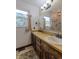 Well-lit bathroom featuring dual sinks, ample counter space, and storage options at 1813 Pikes Peak St, Erie, CO 80516