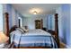 Spacious bedroom featuring a four poster bed, carpet, and large wardrobe at 1813 Pikes Peak St, Erie, CO 80516
