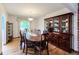 Formal dining room showcases hardwood floors and built-in wood china cabinet at 1813 Pikes Peak St, Erie, CO 80516