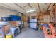 Well-organized garage interior with ample storage, tools, and workbench areas for various projects at 1813 Pikes Peak St, Erie, CO 80516