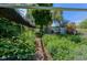 Lush garden area enclosed by wire fencing with mulched ground cover, offering privacy at 1813 Pikes Peak St, Erie, CO 80516