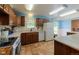 Charming kitchen features tile floors, white appliances, and light countertops at 1813 Pikes Peak St, Erie, CO 80516