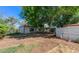 Backyard featuring storage buildings and garden plots, offering space for projects and landscaping at 1813 Pikes Peak St, Erie, CO 80516