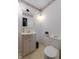 Charming powder room boasts stylish vanity, decorative mirror, and fresh decor at 1813 Pikes Peak St, Erie, CO 80516