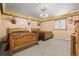 Rustic bedroom with two twin beds, wood floors and unique ceiling at 26269 Richmond Hill Rd, Conifer, CO 80433