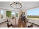 Dining area with hardwood floors, large windows, and scenic views at 26269 Richmond Hill Rd, Conifer, CO 80433