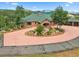 Brick home with circular driveway and mountain views at 26269 Richmond Hill Rd, Conifer, CO 80433