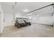 Spacious garage with two ATVs and ample storage at 26269 Richmond Hill Rd, Conifer, CO 80433