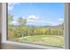 Panoramic mountain views from a large window at 26269 Richmond Hill Rd, Conifer, CO 80433