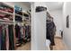 Spacious walk-in closet with ample shelving and hanging space at 26269 Richmond Hill Rd, Conifer, CO 80433