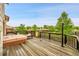 Back deck with a hot tub, offering a private retreat with views of the surrounding landscape at 13008 Grove Way, Broomfield, CO 80020