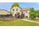 Home's backyard features a garden, wooden deck, and grassy lawn at 13008 Grove Way, Broomfield, CO 80020