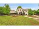 Expansive backyard with a well-maintained lawn and a two-story house with an elevated wood deck at 13008 Grove Way, Broomfield, CO 80020