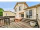 Exterior view of home featuring a spacious deck, and sliding glass door to access the home at 13008 Grove Way, Broomfield, CO 80020