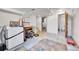 Open basement space featuring tile flooring, utility connections, and an open doorway at 13008 Grove Way, Broomfield, CO 80020
