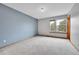 Bedroom with large windows and neutral carpet and paint at 13008 Grove Way, Broomfield, CO 80020