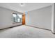 Bedroom with large windows, natural trim and neutral carpet at 13008 Grove Way, Broomfield, CO 80020