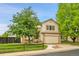 Charming two-story home features a well-maintained front yard and attached two car garage at 13008 Grove Way, Broomfield, CO 80020