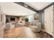 Cozy basement area featuring modern furniture, a TV, and natural lighting at 14732 E Poundstone Dr, Aurora, CO 80015