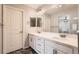 Bright, dual-vanity bathroom with a large mirror and separate shower at 14732 E Poundstone Dr, Aurora, CO 80015