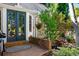 Backyard entrance with brick pavers, mature landscaping, and a pond at 7001 S Newport St, Centennial, CO 80112