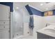 Bathroom with walk-in shower and blue and white bead board at 7001 S Newport St, Centennial, CO 80112