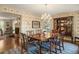 Traditional dining room with hardwood floors and wallpaper at 7001 S Newport St, Centennial, CO 80112